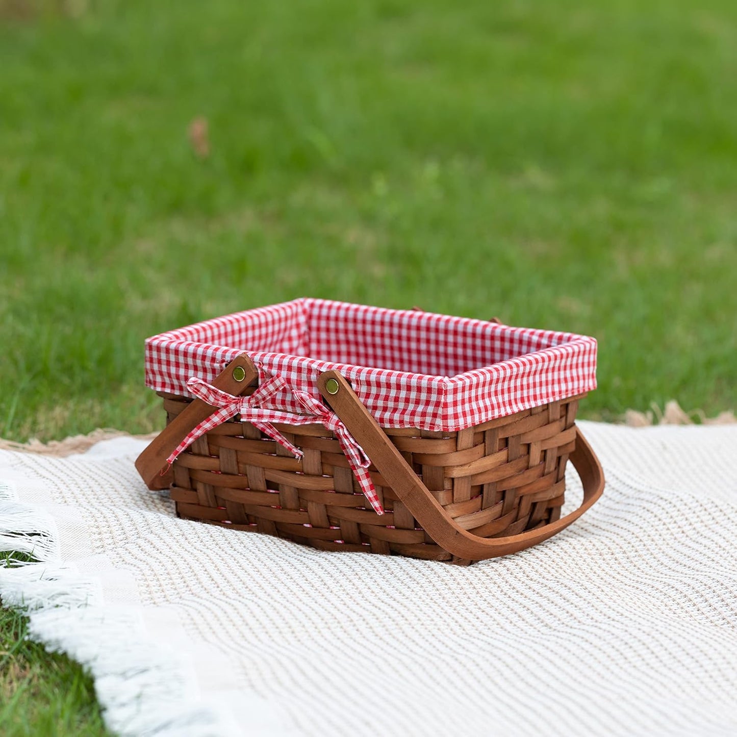 Small rectangular wood chip picnic basket with double folding handles, natural hand woven basket lined with plaid red and white lining, perfect for gift giving